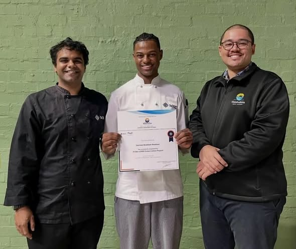 1000 Hills Chef School graduates Chef Journee and Chef Uno receiving their Shosholoza Ocean Academy certificates before joining MSC Cruise Ships